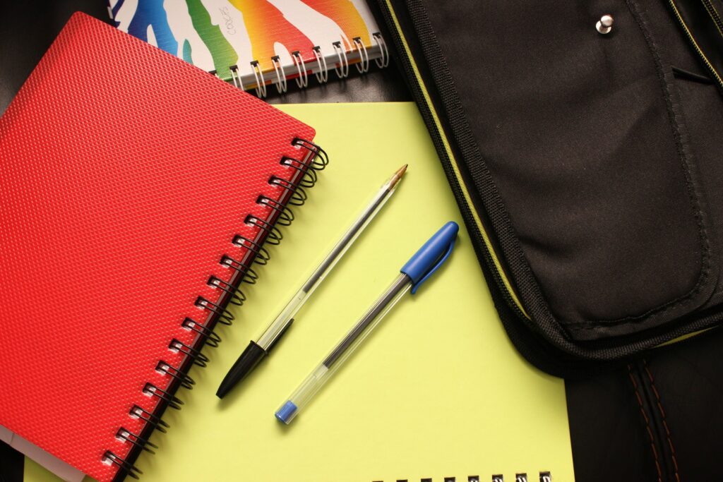 school notebook binders notepad 159497 159497 A close-up view of colorful notebooks and pens, perfect for educational themes.